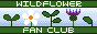 button with the text 'wildflower fan club'. the text is in green banners on the top and bottom, and in the middle there are several pixellated drawings of flowers and shoots.